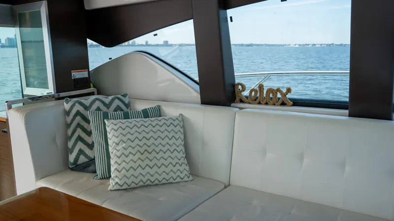 Slide: The Image of Interior of 2016 Tiara Yachts C44 Coupe with stylish cushions and "Relax" decor. - 14