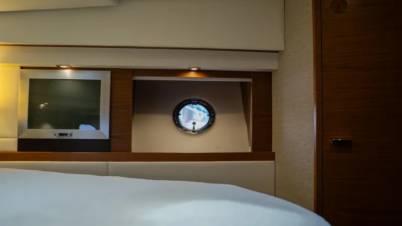 Slide: The Image of Interior of 2016 Tiara Yachts C44 Coupe with porthole and TV. - 26