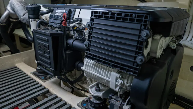 Slide: The Image of Engine compartment of 2016 Tiara Yachts C44 Coupe, showcasing mechanical components. - 39