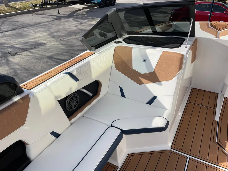 Slide: The Image of 2024 Nautique Super Air Nautique GS22 interior with stylish seating and modern design. - 10