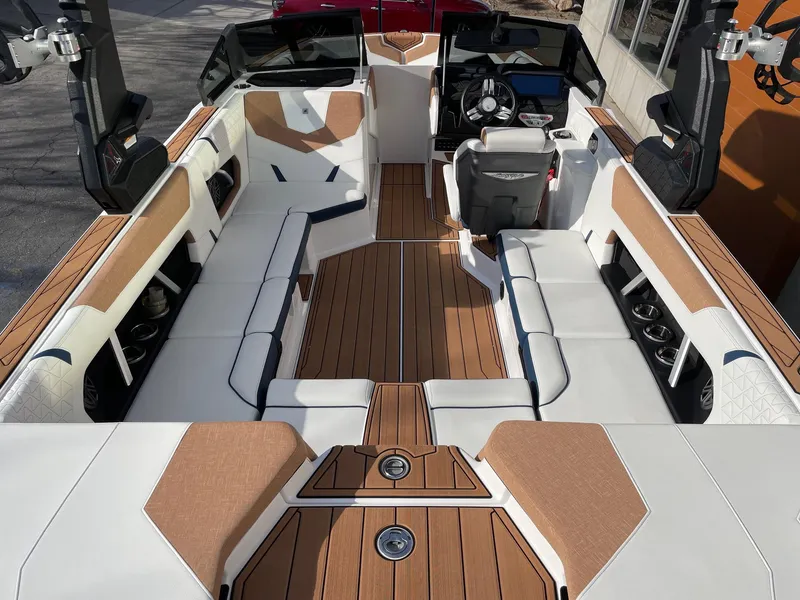 Slide: The Image of 2024 Nautique Super Air Nautique GS22 interior with luxurious seating and modern dashboard. - 5