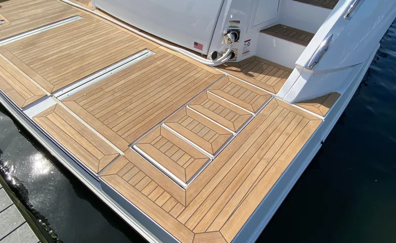 Slide: The Image of Luxury teak deck of 2022 Cruisers Yachts 60 Fly, featuring elegant steps. - 10