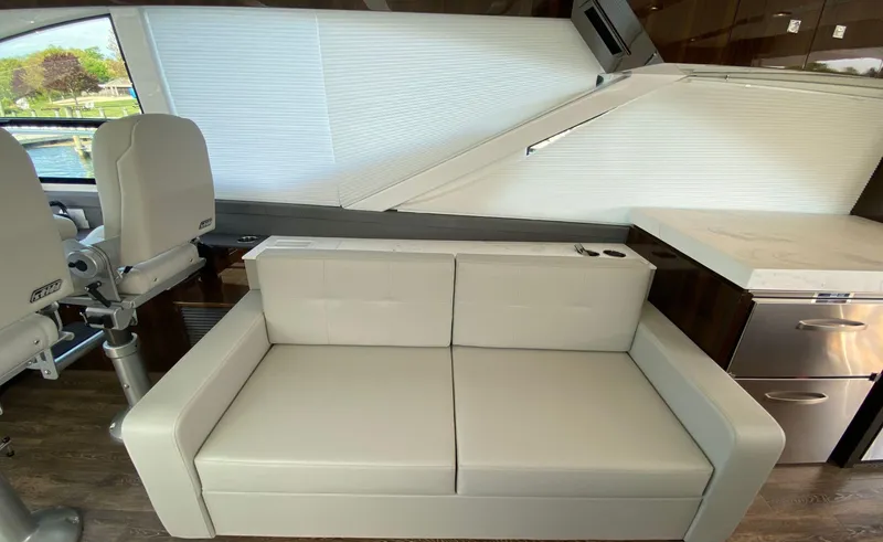 Slide: The Image of Luxurious interior of 2022 Cruisers Yachts 60 Fly with modern seating and sleek design. - 31