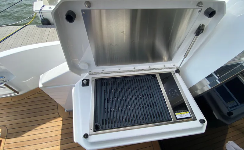 Slide: The Image of Outdoor grill on 2022 Cruisers Yachts 60 Fly, featuring sleek design and modern amenities. - 15