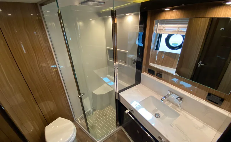 Slide: The Image of Luxurious bathroom in 2022 Cruisers Yachts 60 Fly, featuring modern fixtures and elegant design. - 48