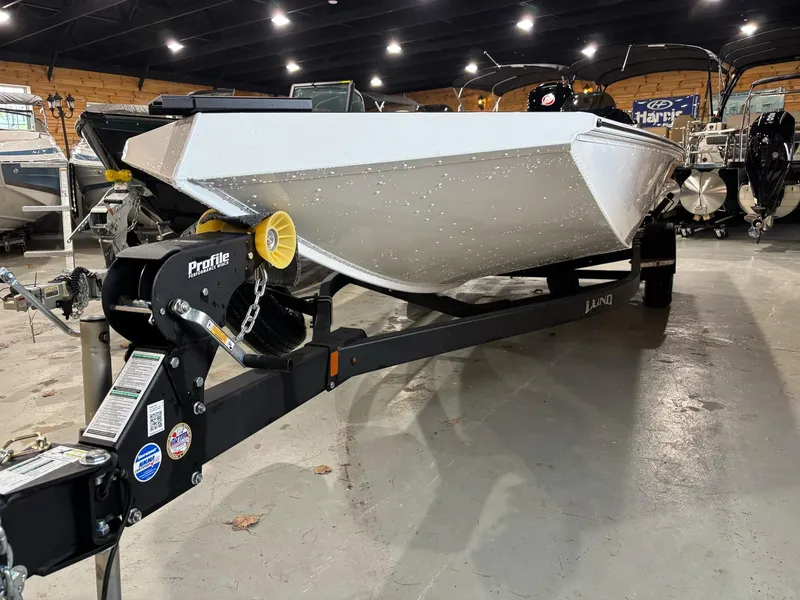 Slide: The Image of 2025 Lund 1975 Renegade SS boat on trailer in showroom. - 10