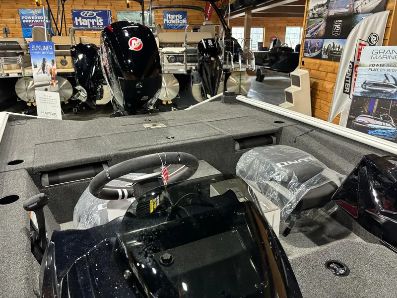 Slide: The Image of Interior view of 2025 Lund 1975 Renegade SS boat in showroom. - 13