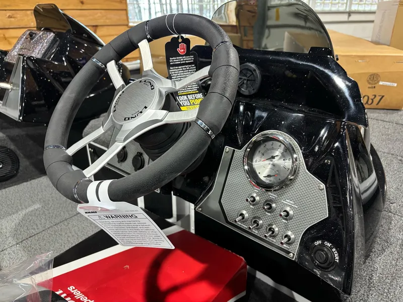 Slide: The Image of Steering console of 2025 Lund 1975 Renegade SS boat with gauges and controls. - 16