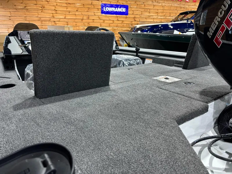Slide: The Image of Interior of 2025 Lund 1975 Renegade SS boat with carpeted deck and Lowrance equipment. - 18