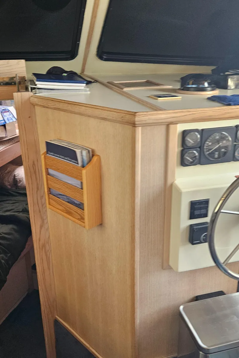 Slide: The Image of Interior of 1991 Tollycraft Euro Sport Sedan with control panel and wooden accents. - 25