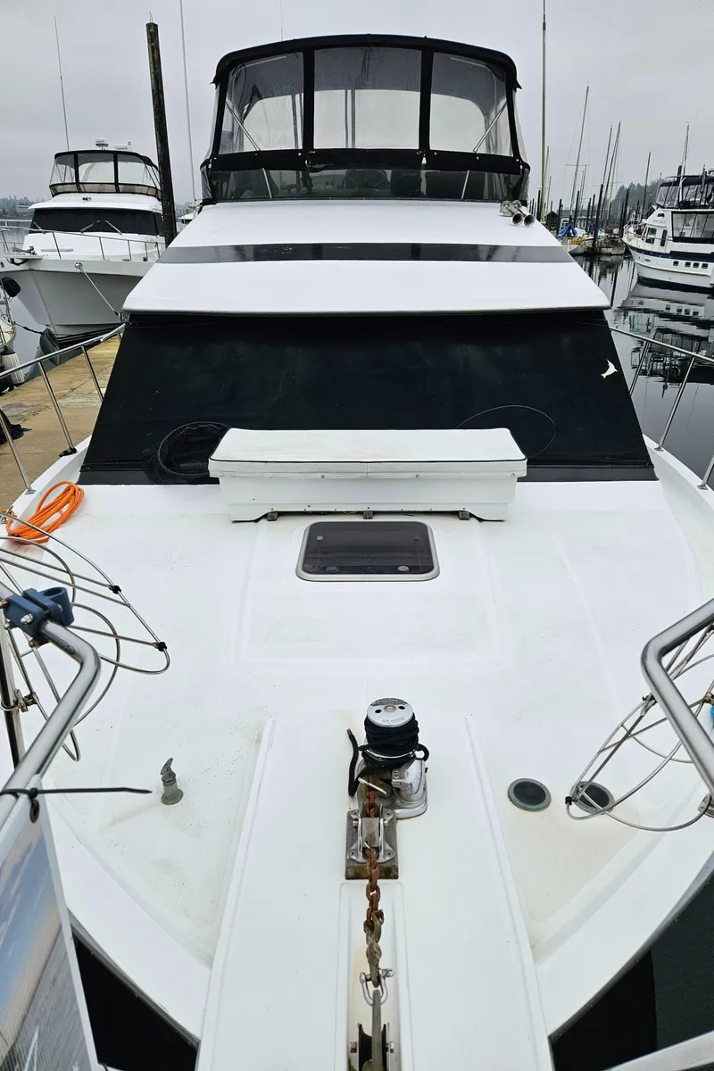 Slide: The Image of 1991 Tollycraft Euro Sport Sedan yacht docked at marina, front view. - 3