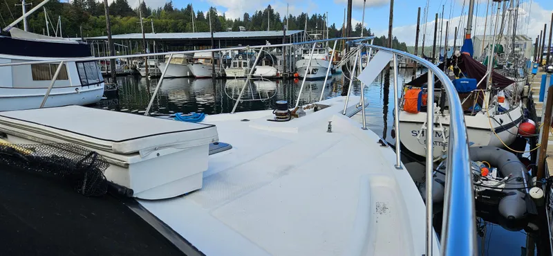Slide: The Image of 1991 Tollycraft Euro Sport Sedan docked at marina with other boats. - 4