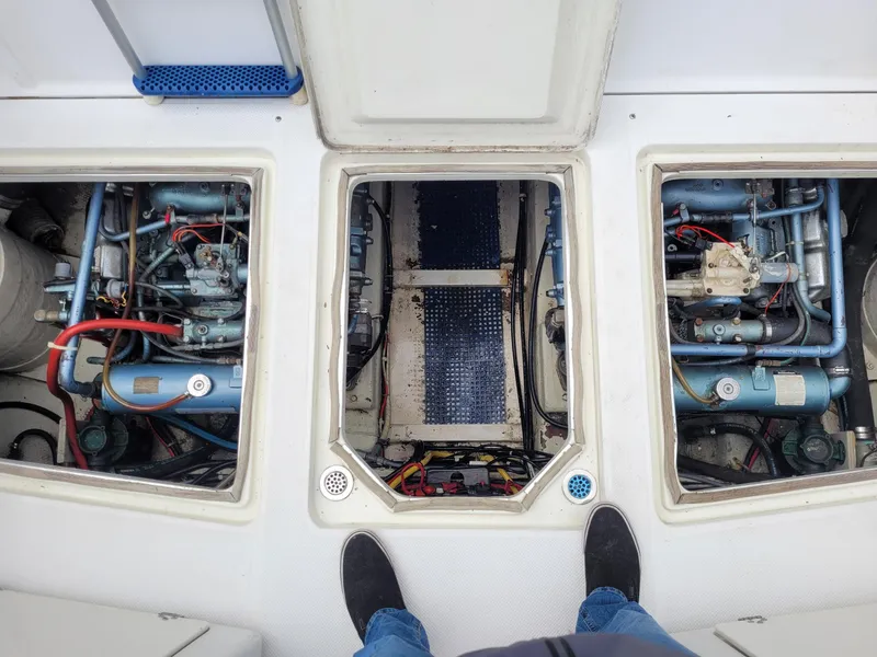 Slide: The Image of Engine compartment of 1991 Tollycraft Euro Sport Sedan boat, showing mechanical components. - 55