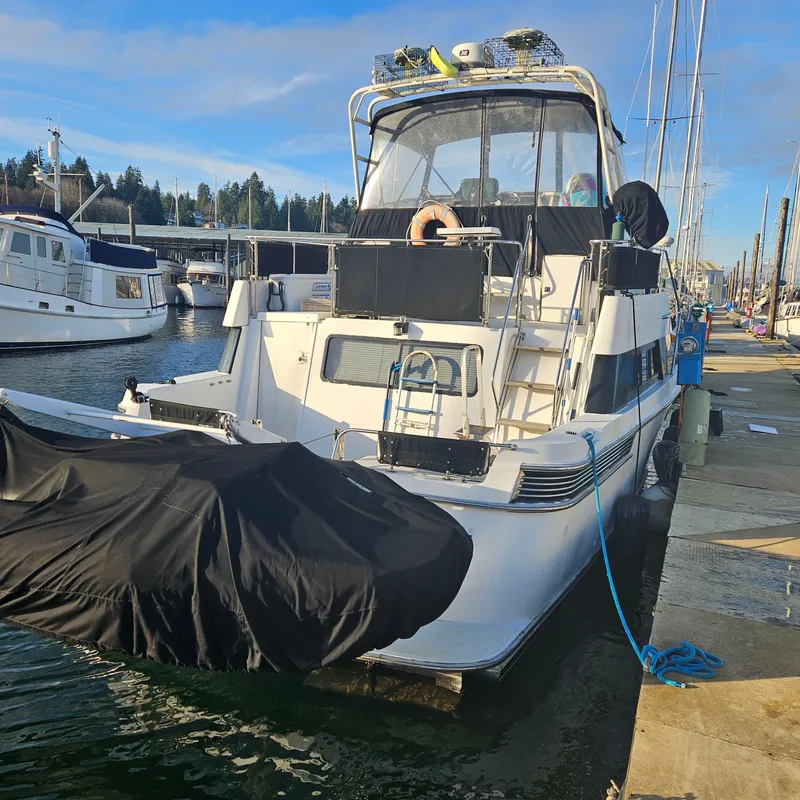 Slide: The Image of 1991 Tollycraft Euro Sport Sedan docked at marina, rear view. - 7
