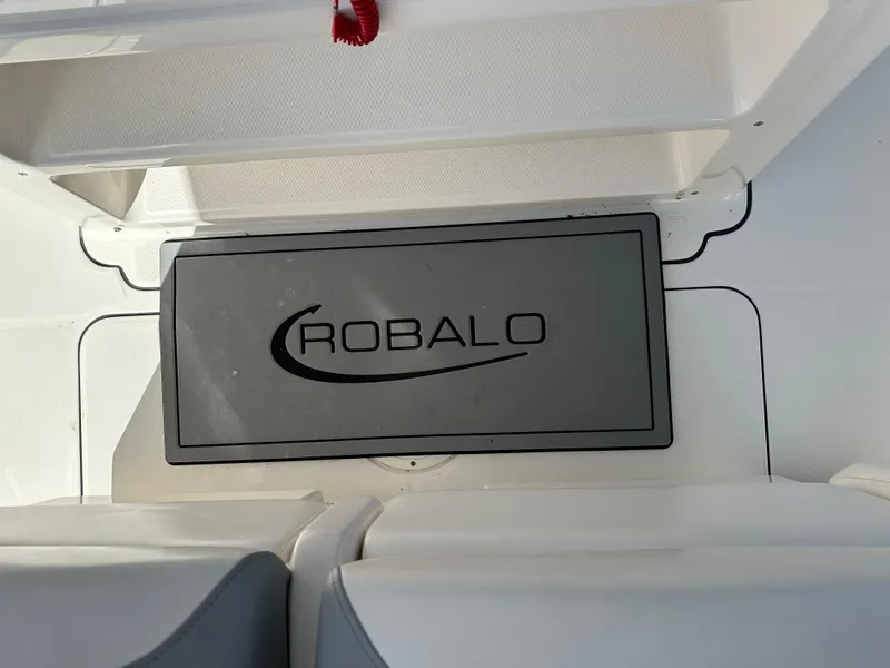 Slide: The Image of Robalo R302 Center Console 2021 boat interior with branded floor mat. - 17