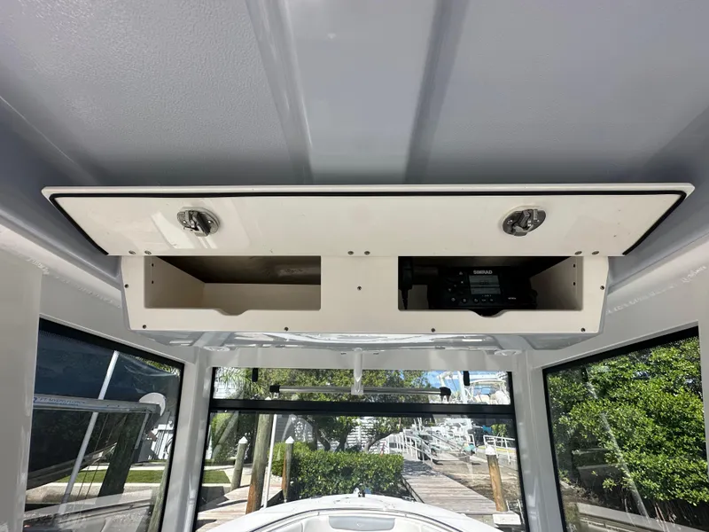 Slide: The Image of 2021 Robalo R302 Center Console boat interior storage compartments. - 18