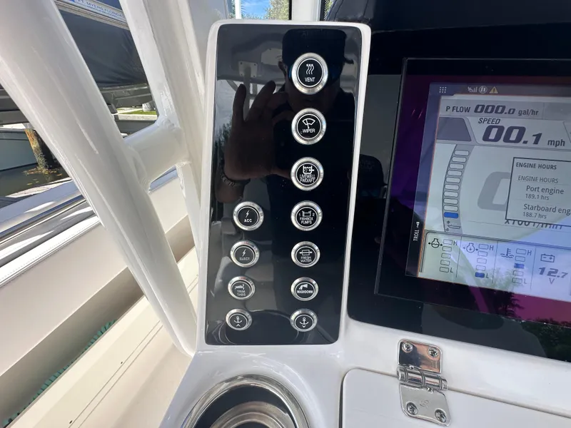 Slide: The Image of Control panel of 2021 Robalo R302 Center Console boat with digital display. - 27