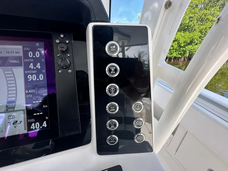 Slide: The Image of Control panel of 2021 Robalo R302 Center Console boat with digital display. - 28