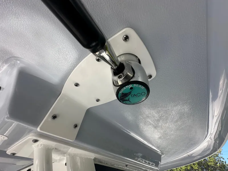 Slide: The Image of Close-up of 2021 Robalo R302 Center Console boat's TACO Grand Slam outrigger mount. - 33