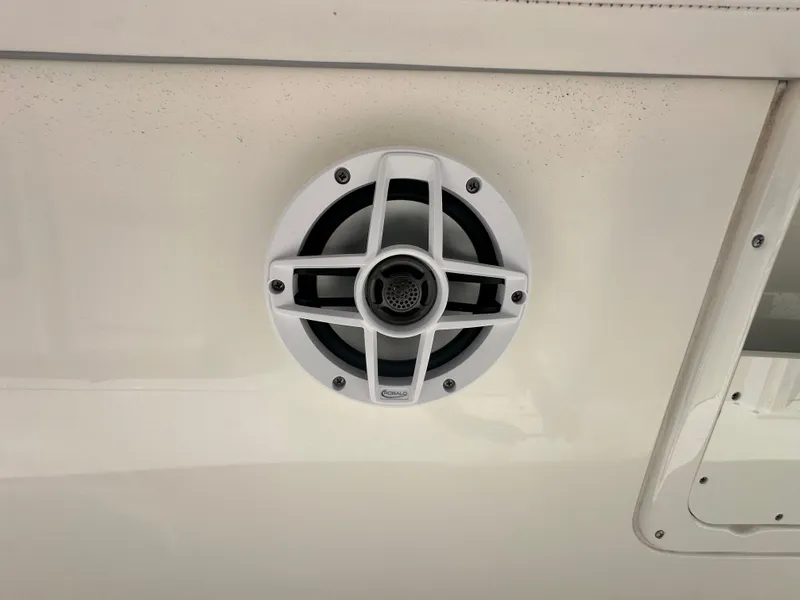 Slide: The Image of 2021 Robalo R302 Center Console boat speaker detail. - 35