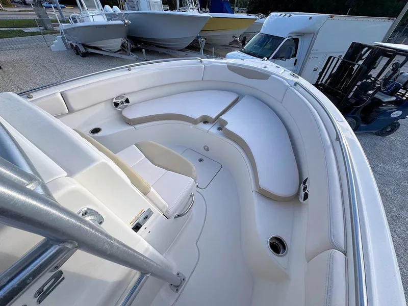 Slide: The Image of 2016 Robalo R222 Center Console boat interior with seating and storage. - 10