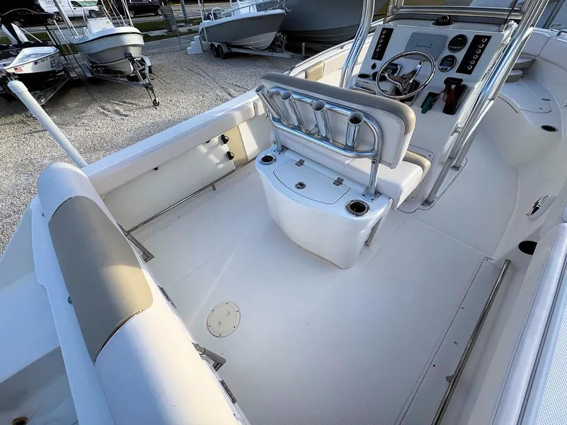 Slide: The Image of 2016 Robalo R222 Center Console boat interior with seating and steering console. - 6