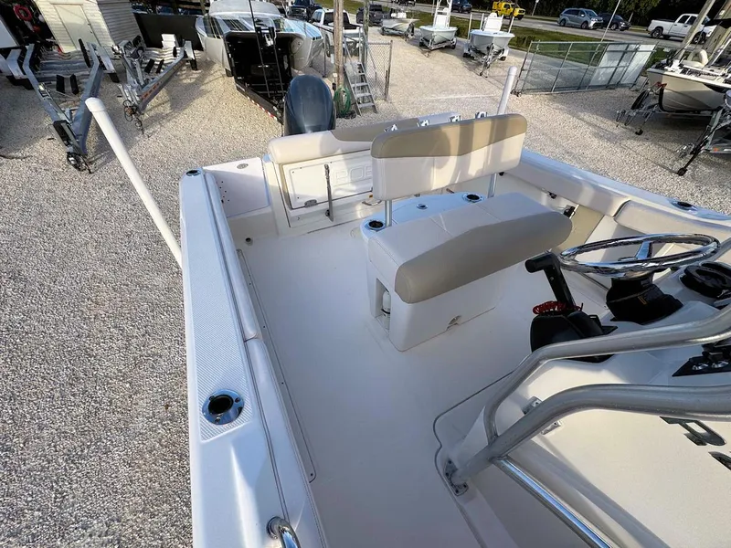 Slide: The Image of 2016 Robalo R222 Center Console boat interior with seating and steering wheel. - 7