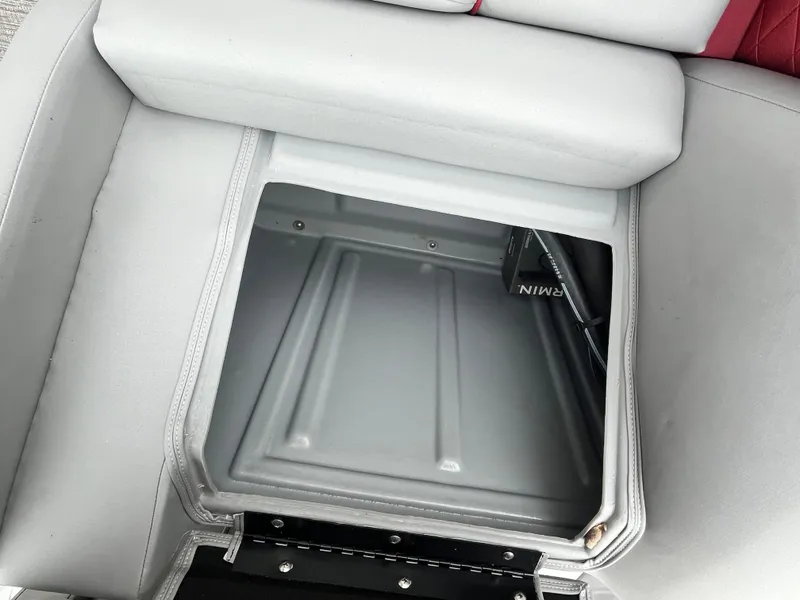 Slide: The Image of 2024 Bennington 25LTFB boat seat storage compartment, open and empty. - 16