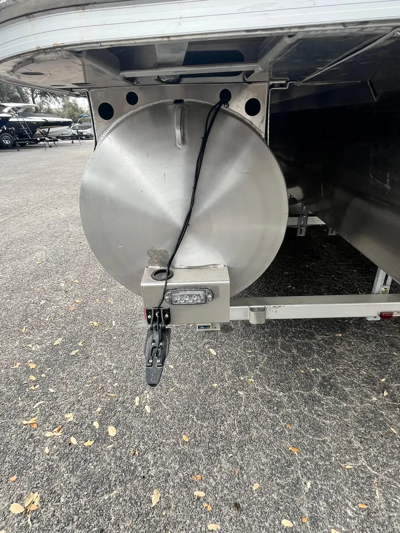 Slide: The Image of 2024 Bennington 25LTFB pontoon boat trailer hitch and underside view. - 18