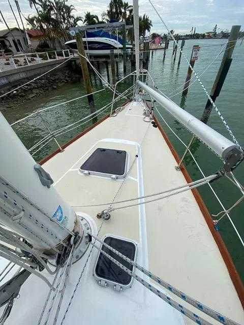 Slide: The Image of Sailboat deck view, Freedom 45 model, 1992, docked near waterfront homes. - 11