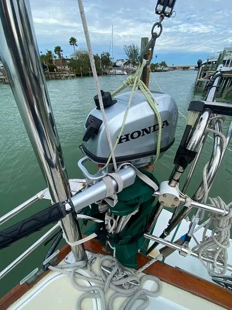 Slide: The Image of Boat with Honda outboard motor, docked in a marina, Freedom 45, 1992 model. - 15