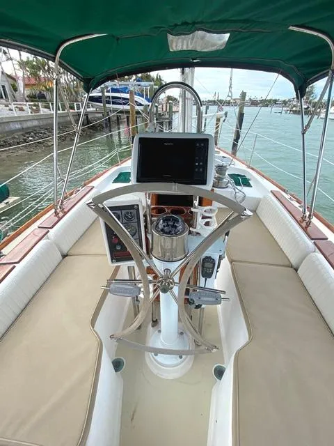 Slide: The Image of Cockpit of 1992 Freedom 45 sailboat with steering wheel and navigation equipment. - 18