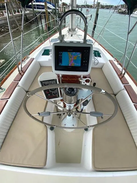 Slide: The Image of Cockpit of 1992 Freedom 45 sailboat with navigation system and steering wheel. - 19