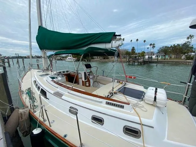 Slide: The Image of Sailboat docked at marina, Freedom 45 model, 1992, with green sail cover. - 4