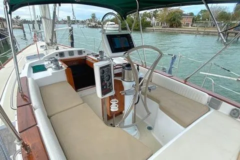 Slide: The Image of Sailboat cockpit of 1992 Freedom 45, featuring navigation equipment and seating. - 6