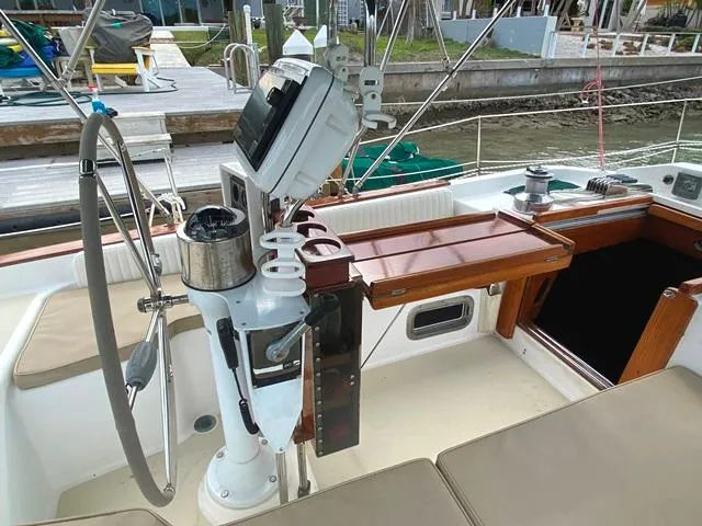 Slide: The Image of Cockpit of 1992 Freedom 45 sailboat with steering wheel and navigation equipment. - 8