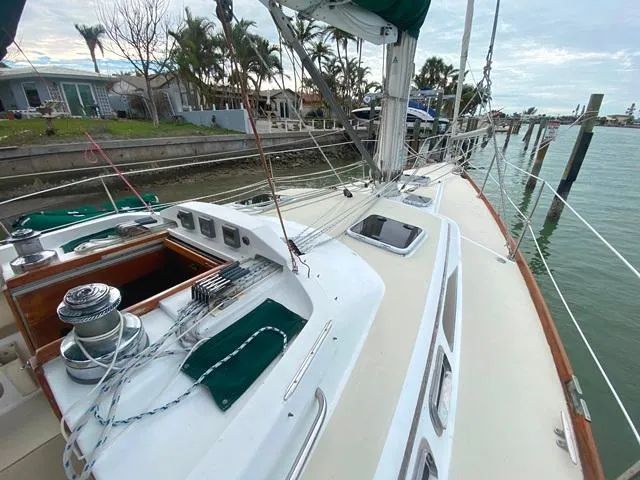 Slide: The Image of Sailboat deck view, Freedom 45 model, 1992, docked near waterfront homes. - 9