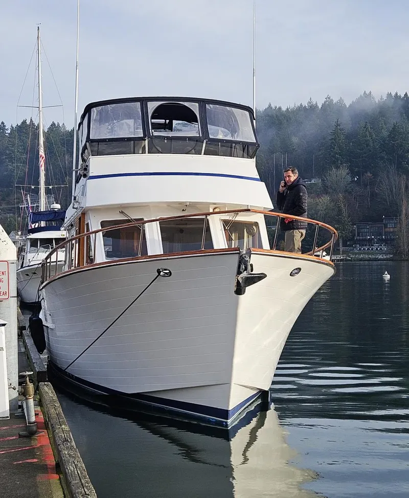The Image of 1983 Ocean Alexander 43 yacht docked in a serene marina setting. - 0
