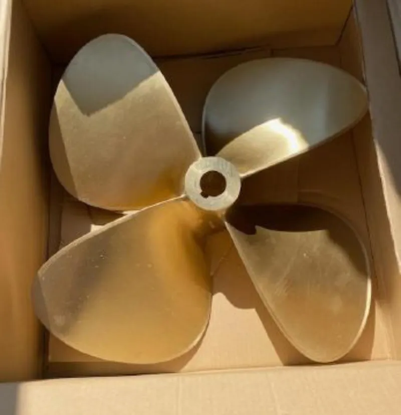 Slide: The Image of Propeller for 1983 Ocean Alexander 43 boat, displayed in a cardboard box. - 12