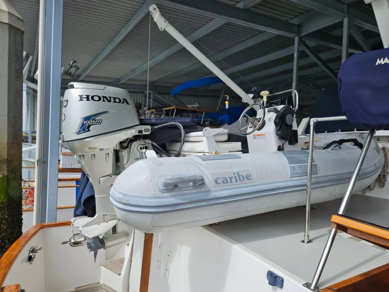 Slide: The Image of Inflatable boat with Honda motor on 1983 Ocean Alexander 43 yacht. - 14
