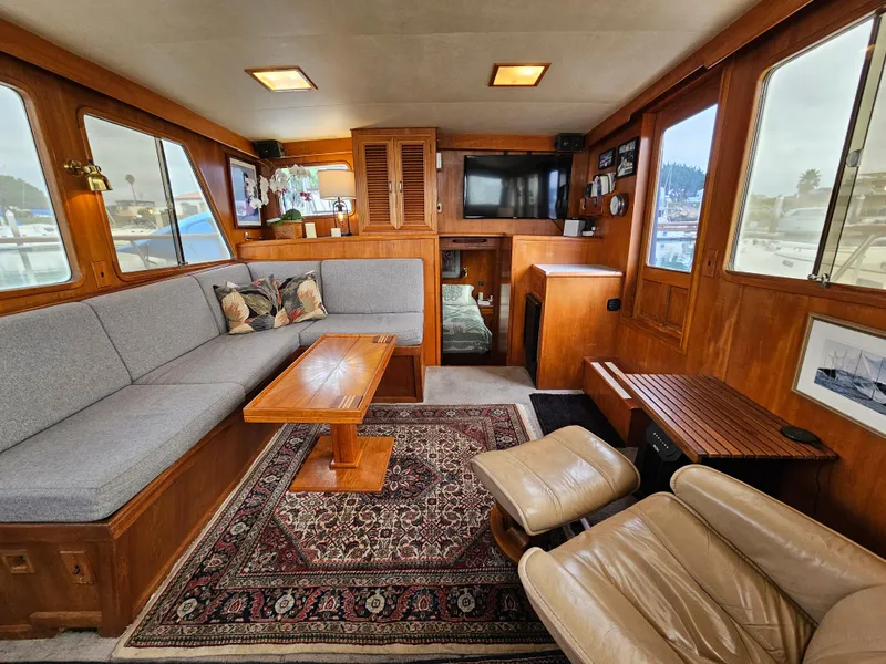 Slide: The Image of Luxurious 1983 Ocean Alexander 43 yacht interior with cozy seating and elegant wood finishes. - 18
