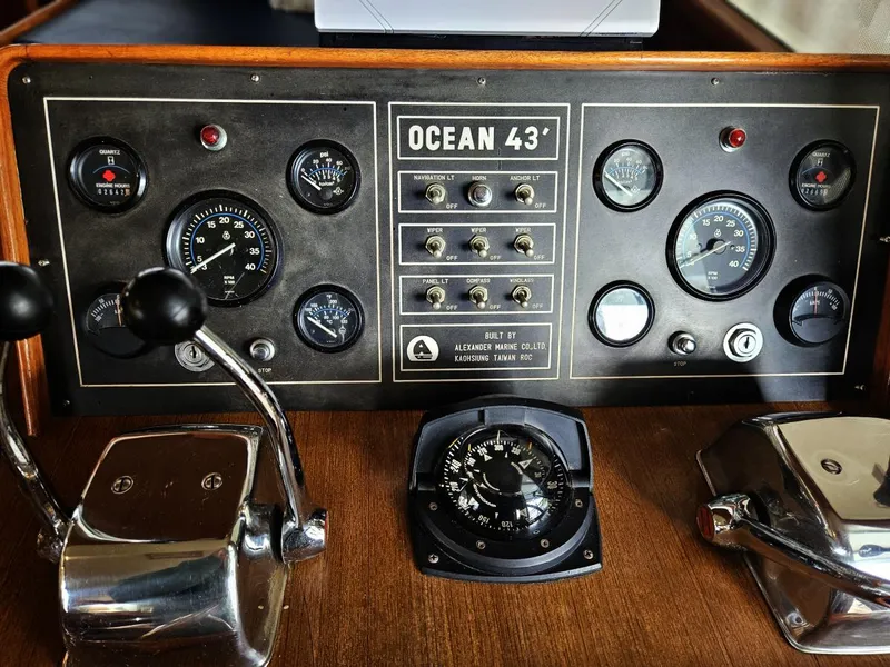 Slide: The Image of Control panel of a 1983 Ocean Alexander 43 yacht with gauges and switches. - 21