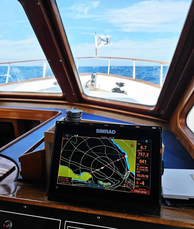 Slide: The Image of Simrad navigation system on 1983 Ocean Alexander 43 yacht, with ocean view through windows. - 22