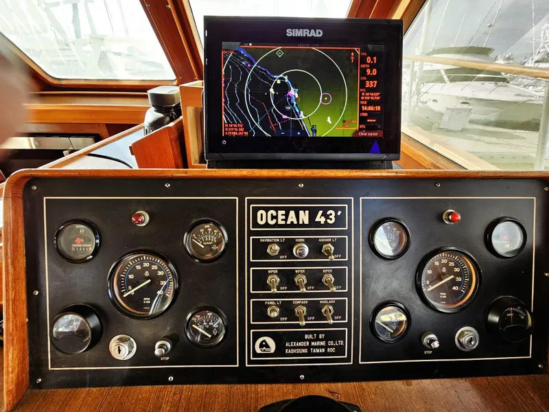 Slide: The Image of Control panel of 1983 Ocean Alexander 43 yacht with navigation display. - 25