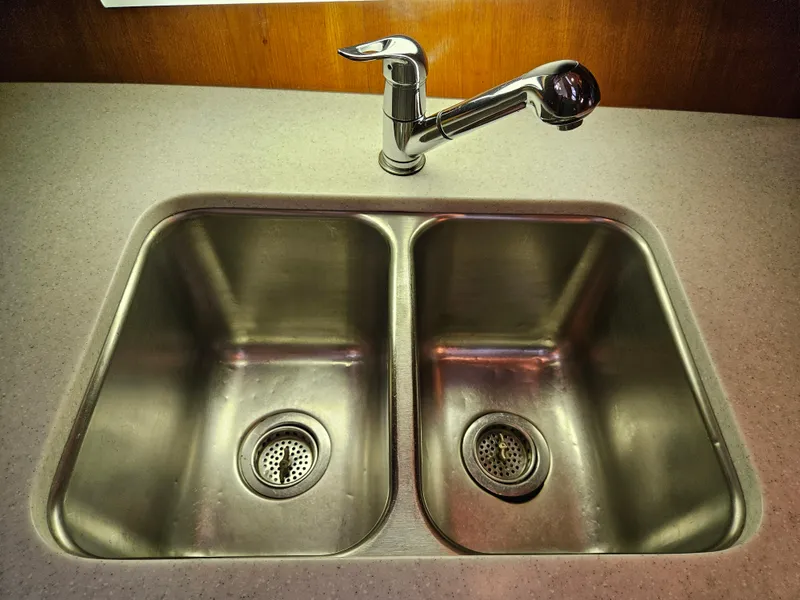 Slide: The Image of Stainless steel double sink with modern faucet on Ocean Alexander 43, 1983 model. - 27
