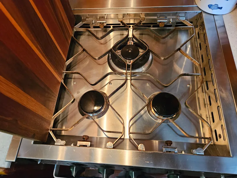 Slide: The Image of Stainless steel stove with three burners on 1983 Ocean Alexander 43 yacht. - 29