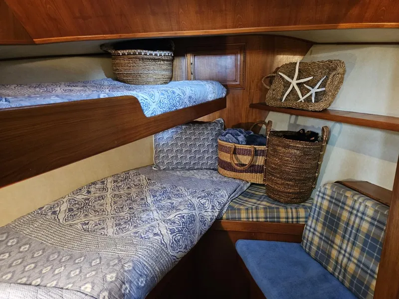 Slide: The Image of Cozy cabin interior of 1983 Ocean Alexander 43 with bunk beds and woven baskets. - 38