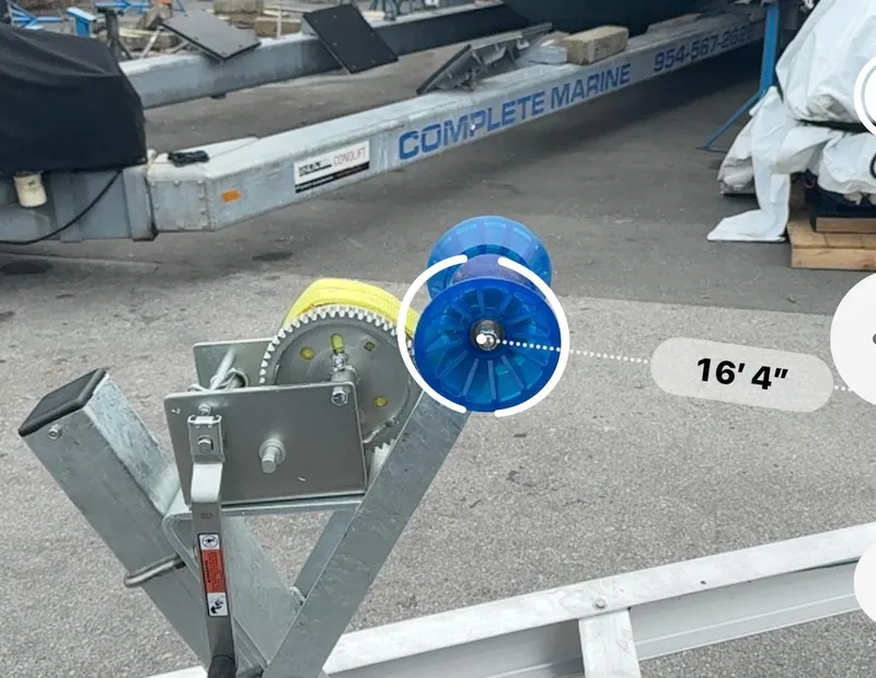 Slide: The Image of 2025 Single Axle Trailer with blue roller and winch, 16' 4" length. - 19