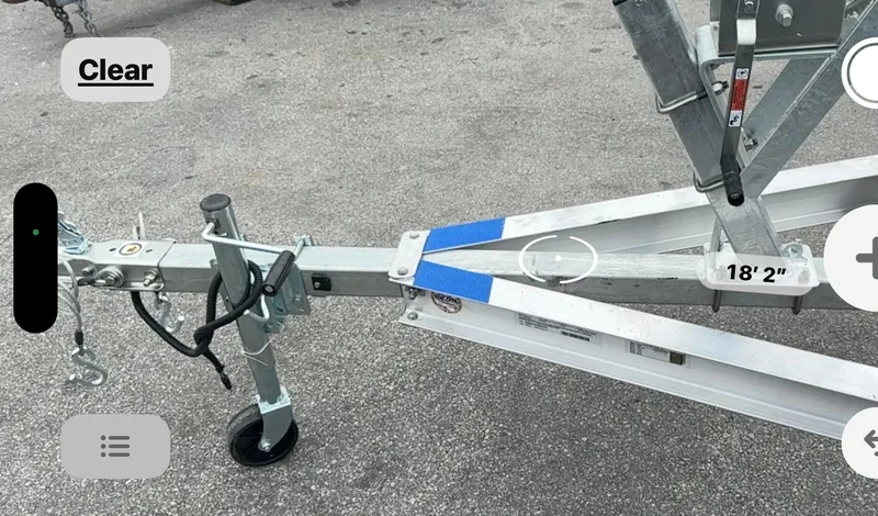 Slide: The Image of 2025 Single Axle Trailer, model 17-19, on asphalt surface. - 20