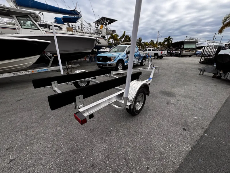 Slide: The Image of 2025 Single Axle Trailer for 17-19 ft boats in a marina setting. - 6